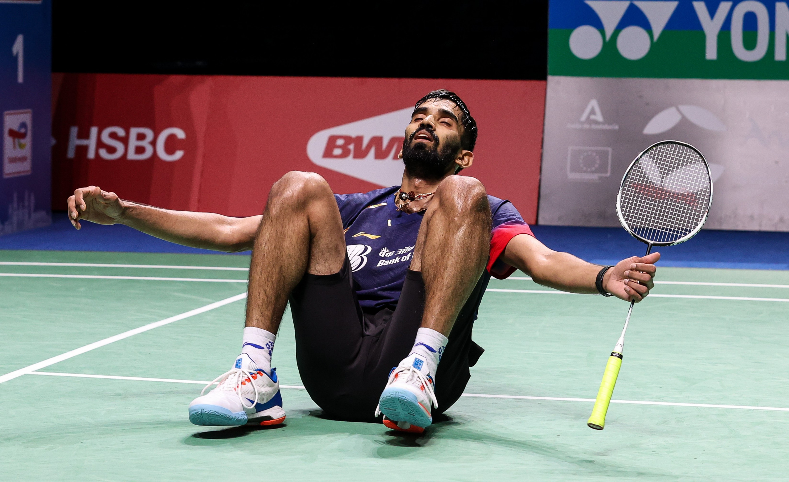 Kidambi Srikanth falls to the ground after winning the grueling semifinal.